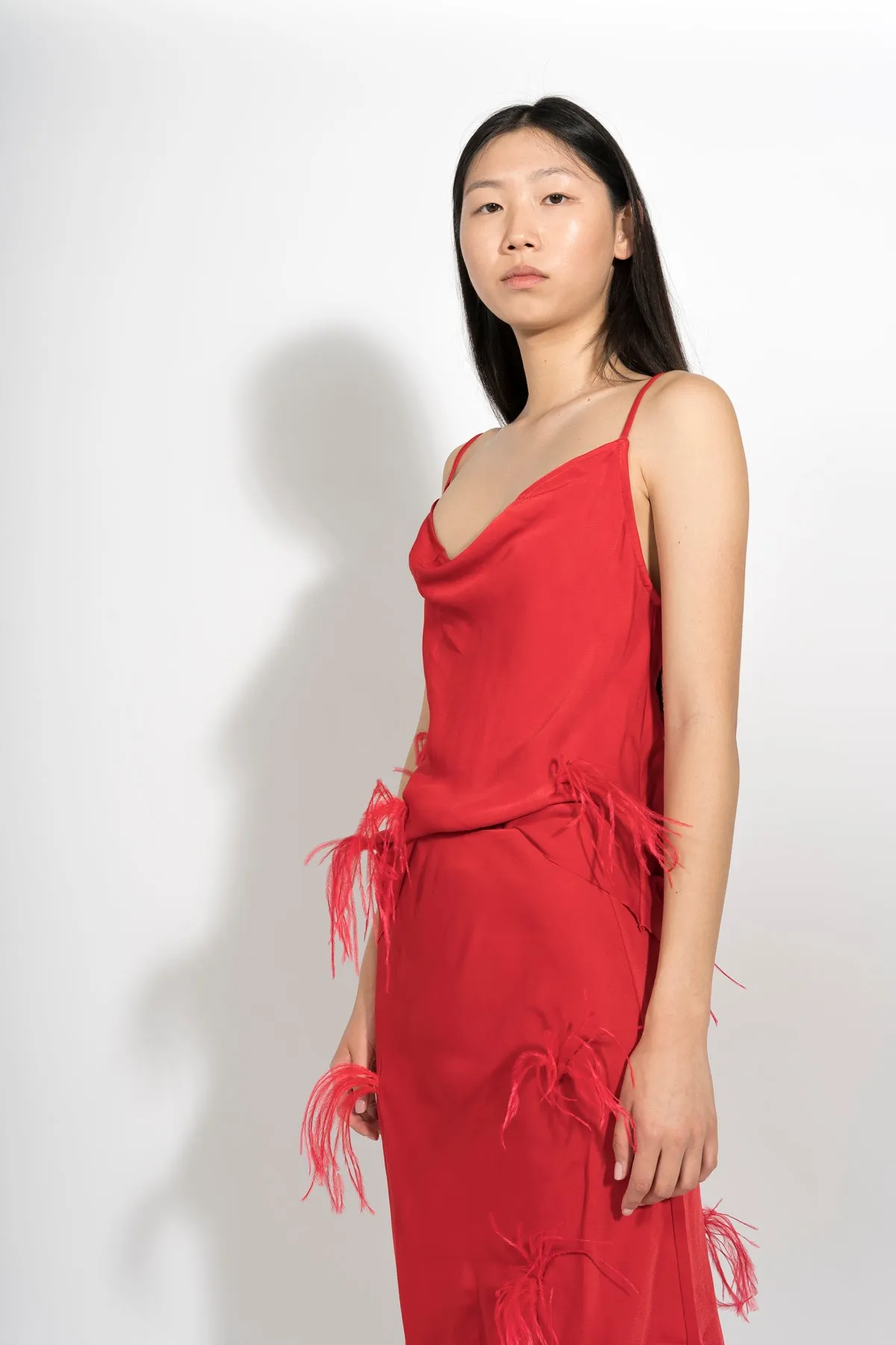 RED SLIP TOP WITH FEATHERS